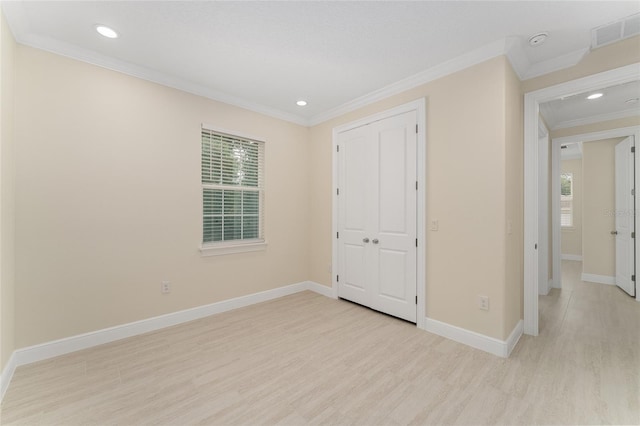 16357 SE 88th Ct, Summerfield, FL 34491 - unfurnished bedroom featuring ornamental molding, light wood-style flooring, baseboards, multiple windows, and recessed lighting