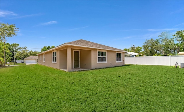16357 SE 88th Ct, Summerfield, FL 34491 - back of property featuring stucco siding and a detached garage