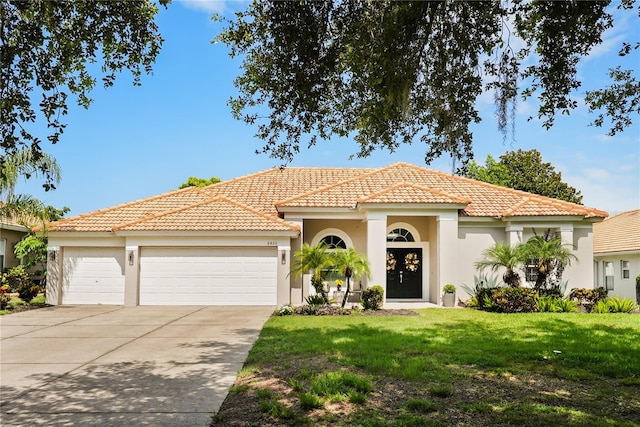6426 Montclair Bluff Ln, Windermere, FL 34786 - mediterranean / spanish house with an attached garage, stucco siding, driveway, and a tile roof