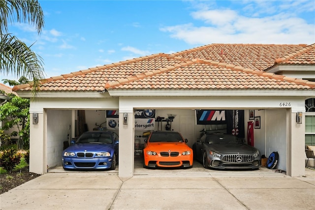 6426 Montclair Bluff Ln, Windermere, FL 34786 - view of car parking featuring concrete driveway and an attached garage