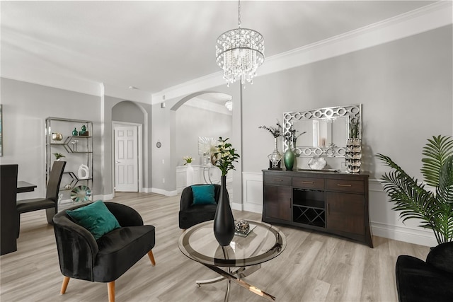 6426 Montclair Bluff Ln, Windermere, FL 34786 - living area with arched walkways, light wood finished floors, a chandelier, ornamental molding, and baseboards