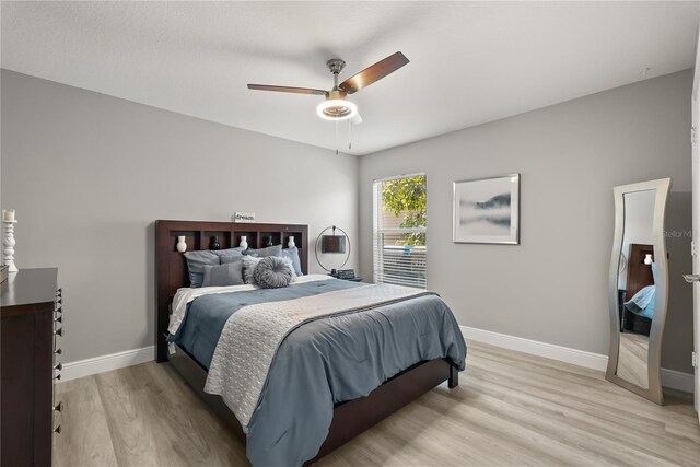 6426 Montclair Bluff Ln, Windermere, FL 34786 - bedroom featuring light wood finished floors, baseboards, and a ceiling fan