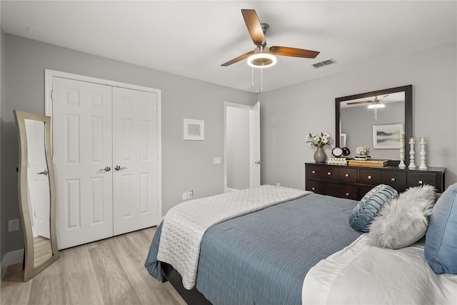 6426 Montclair Bluff Ln, Windermere, FL 34786 - bedroom with light wood finished floors, a closet, and a ceiling fan