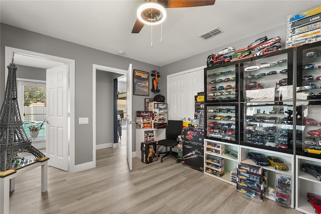 6426 Montclair Bluff Ln, Windermere, FL 34786 - office area with a ceiling fan, wood finished floors, and baseboards