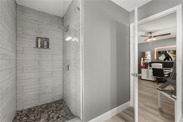 6426 Montclair Bluff Ln, Windermere, FL 34786 - full bathroom featuring a shower stall, ceiling fan, wood finished floors, and baseboards