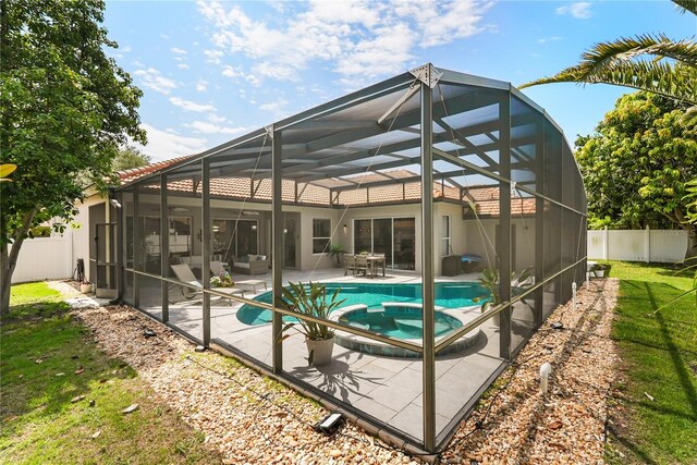 6426 Montclair Bluff Ln, Windermere, FL 34786 - rear view of house with a patio area, a tiled roof, a lanai, and stucco siding