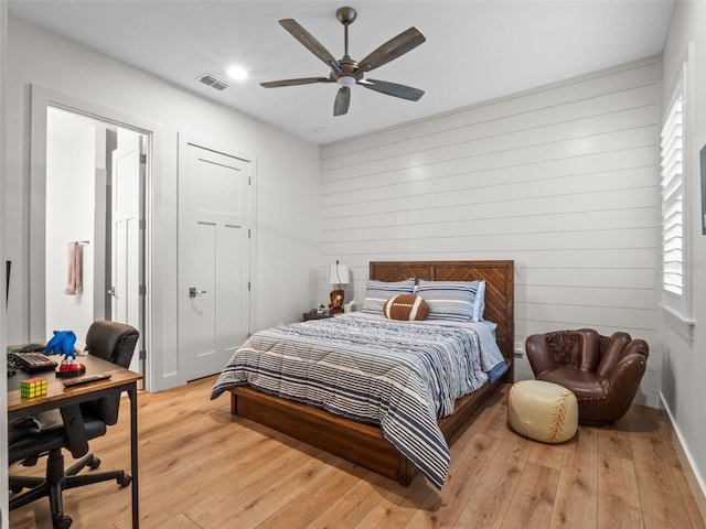 340 Lakeview Rd, Winter Garden, FL 34787 - bedroom with light wood-style flooring, a desk, wood walls, a ceiling fan, and recessed lighting
