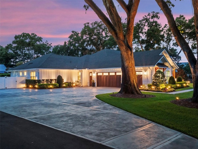 340 Lakeview Rd, Winter Garden, FL 34787 - ranch-style house featuring curved driveway, a gate, an attached garage, and a shingled roof