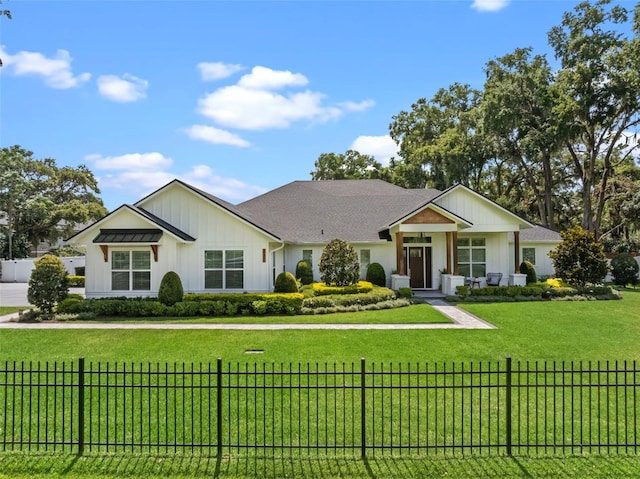 340 Lakeview Rd, Winter Garden, FL 34787 - view of front of property with board and batten siding and a fenced front yard