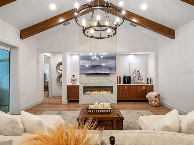 340 Lakeview Rd, Winter Garden, FL 34787 - living room with beamed ceiling, a chandelier, light wood finished floors, a large fireplace, and high vaulted ceiling