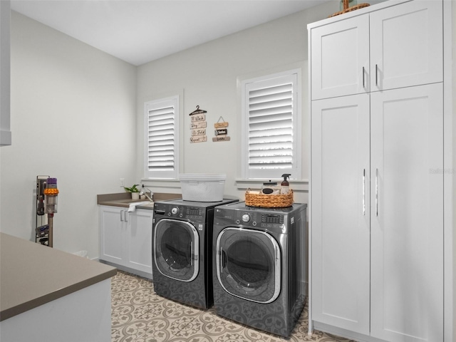 340 Lakeview Rd, Winter Garden, FL 34787 - laundry area with cabinet space, washing machine and clothes dryer, and healthy amount of natural light