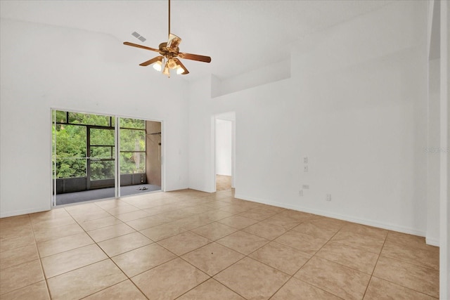 3390 Cypress Point Cir, Saint Cloud, FL 34772 - spare room featuring high vaulted ceiling, light tile patterned floors, ceiling fan, and baseboards