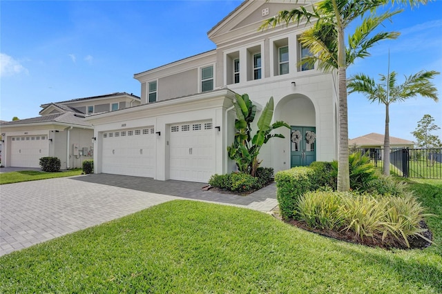 5609 Zestar Ln, Loxahatchee, FL 33470 - view of front of property with decorative driveway, stucco siding, and an attached garage