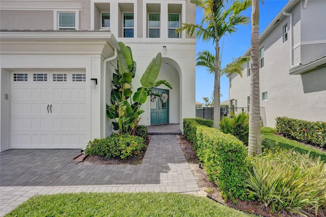 5609 Zestar Ln, Loxahatchee, FL 33470 - entrance to property with an attached garage and stucco siding