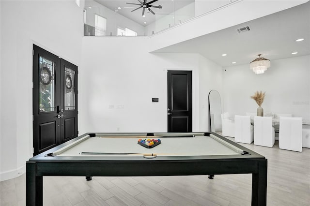 5609 Zestar Ln, Loxahatchee, FL 33470 - game room with pool table, a high ceiling, recessed lighting, light wood-style flooring, and baseboards