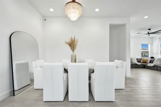 5609 Zestar Ln, Loxahatchee, FL 33470 - dining area featuring a chandelier, recessed lighting, a ceiling fan, light wood-type flooring, and baseboards