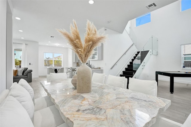5609 Zestar Ln, Loxahatchee, FL 33470 - dining area with stairs, recessed lighting, wood finished floors, and baseboards