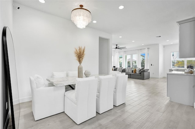 5609 Zestar Ln, Loxahatchee, FL 33470 - dining space with recessed lighting, ceiling fan, baseboards, a chandelier, and light wood-type flooring