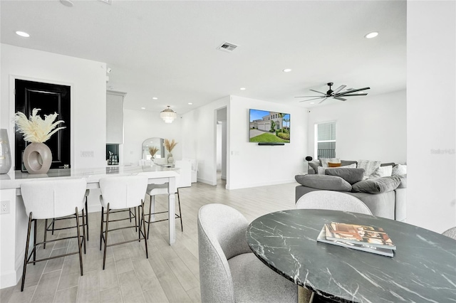 5609 Zestar Ln, Loxahatchee, FL 33470 - dining area featuring light wood-style floors, ceiling fan, recessed lighting, and baseboards
