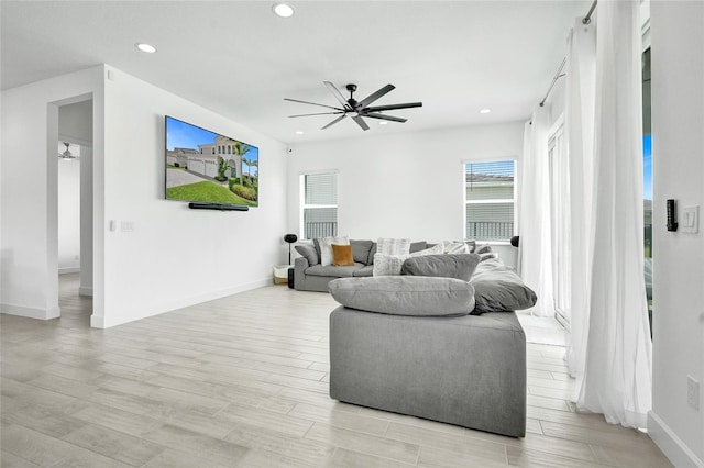 5609 Zestar Ln, Loxahatchee, FL 33470 - living room with ceiling fan, recessed lighting, and baseboards