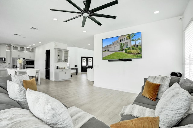 5609 Zestar Ln, Loxahatchee, FL 33470 - living area featuring light wood-style flooring, a ceiling fan, recessed lighting, and baseboards