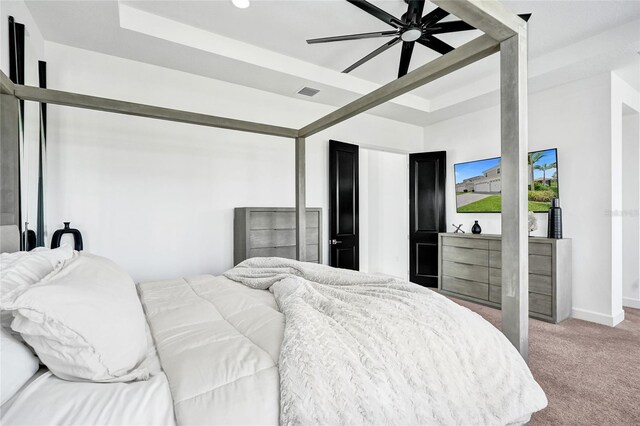 5609 Zestar Ln, Loxahatchee, FL 33470 - carpeted bedroom featuring a tray ceiling, baseboards, a ceiling fan, and recessed lighting