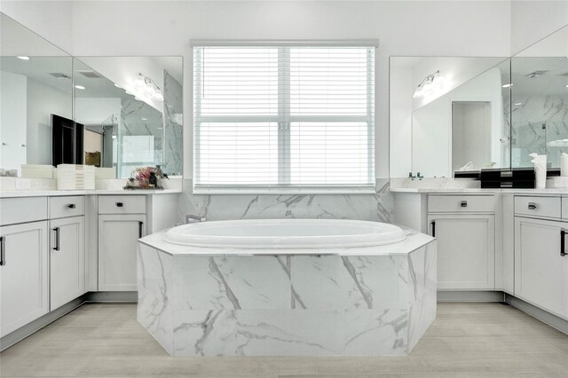 5609 Zestar Ln, Loxahatchee, FL 33470 - full bathroom with a bath, healthy amount of natural light, and two vanities