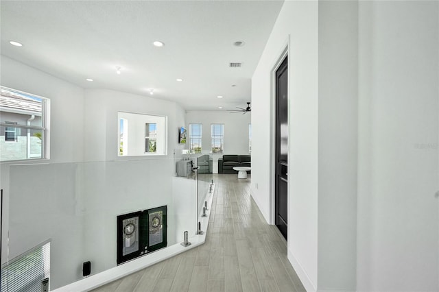5609 Zestar Ln, Loxahatchee, FL 33470 - hall with recessed lighting, light wood-type flooring, and baseboards