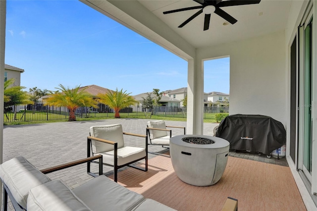 5609 Zestar Ln, Loxahatchee, FL 33470 - view of patio / terrace with a ceiling fan, a residential view, and an outdoor living space with a fire pit