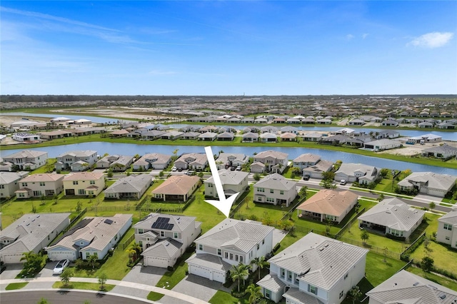 5609 Zestar Ln, Loxahatchee, FL 33470 - aerial perspective of suburban area with a nearby body of water