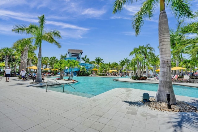 5609 Zestar Ln, Loxahatchee, FL 33470 - community pool featuring a patio area