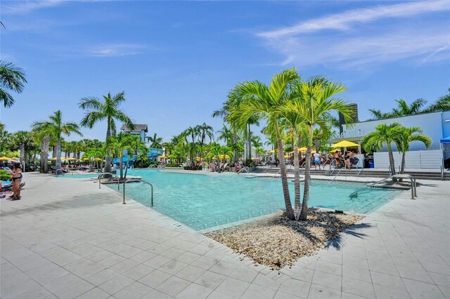 5609 Zestar Ln, Loxahatchee, FL 33470 - community pool featuring a patio