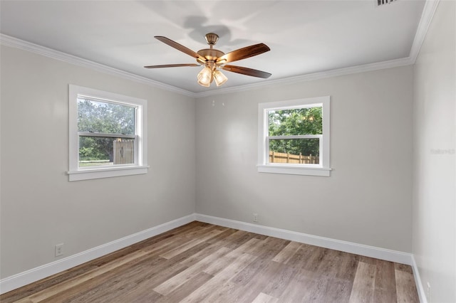 588 Hwy 630 E, Frostproof, FL 33843 - spare room featuring plenty of natural light, light wood-type flooring, baseboards, and ornamental molding