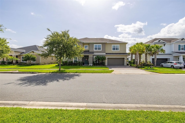 1113 Fieldstone Cir, Oviedo, FL 32765 - view of front of house with concrete driveway, an attached garage, stucco siding, and a residential view