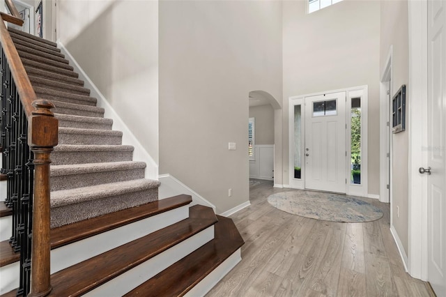 1113 Fieldstone Cir, Oviedo, FL 32765 - entryway with arched walkways, wood finished floors, stairway, and a towering ceiling
