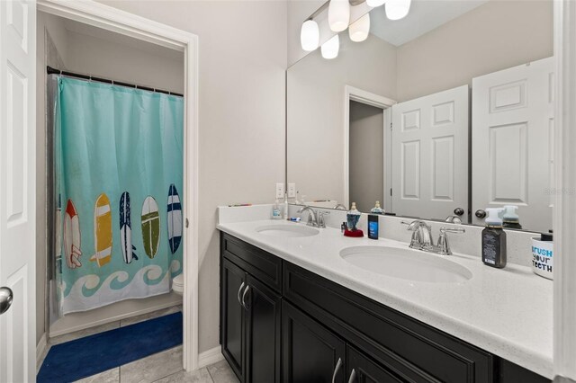 1113 Fieldstone Cir, Oviedo, FL 32765 - full bath featuring double vanity, tile patterned floors, and a shower with shower curtain