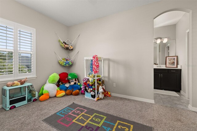 1113 Fieldstone Cir, Oviedo, FL 32765 - rec room featuring arched walkways and carpet flooring