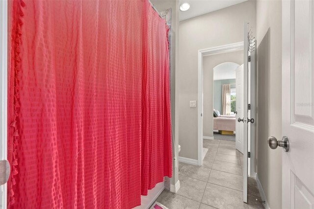 1113 Fieldstone Cir, Oviedo, FL 32765 - ensuite bathroom with tile patterned flooring and a shower with shower curtain