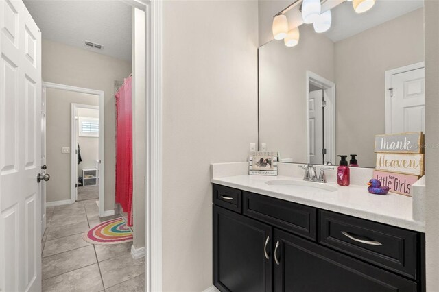1113 Fieldstone Cir, Oviedo, FL 32765 - bathroom featuring vanity, tile patterned flooring, and curtained shower