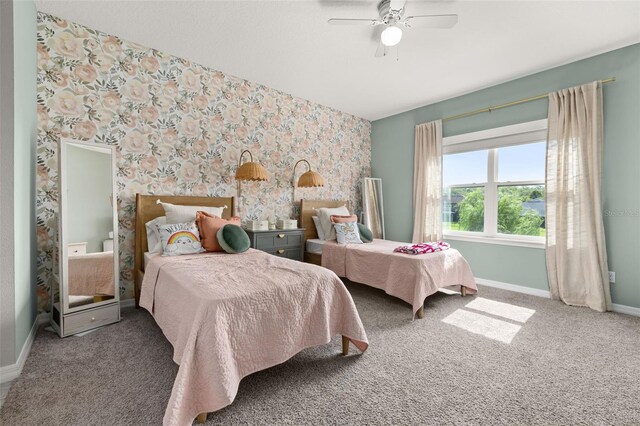 1113 Fieldstone Cir, Oviedo, FL 32765 - bedroom with wallpapered walls, carpet flooring, an accent wall, and a ceiling fan
