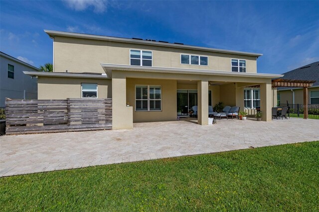 1113 Fieldstone Cir, Oviedo, FL 32765 - back of house featuring stucco siding, a patio area, and an outdoor living space