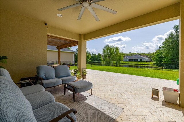 1113 Fieldstone Cir, Oviedo, FL 32765 - fenced backyard featuring a patio area, a ceiling fan, and an outdoor living space