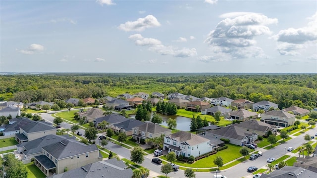 1113 Fieldstone Cir, Oviedo, FL 32765 - aerial perspective of suburban area featuring a heavily wooded area and a nearby body of water