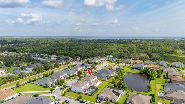 1113 Fieldstone Cir, Oviedo, FL 32765 - aerial view of residential area with a forest and a large body of water