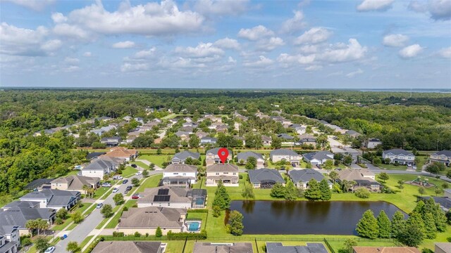 1113 Fieldstone Cir, Oviedo, FL 32765 - aerial view of residential area with a large body of water and a heavily wooded area