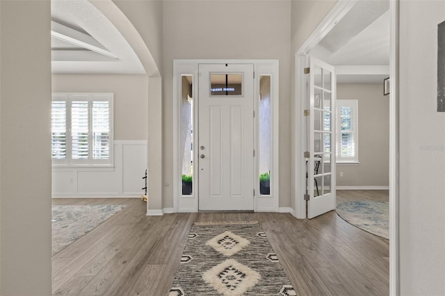 1113 Fieldstone Cir, Oviedo, FL 32765 - entrance foyer featuring wood finished floors and a wainscoted wall