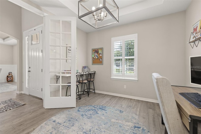 1113 Fieldstone Cir, Oviedo, FL 32765 - home office with wood finished floors, a chandelier, and arched walkways