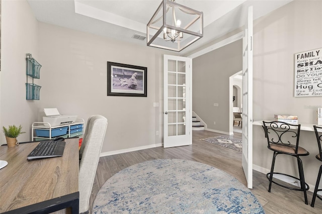 1113 Fieldstone Cir, Oviedo, FL 32765 - office with a chandelier, wood finished floors, arched walkways, and french doors