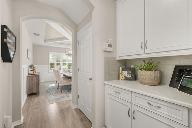 1113 Fieldstone Cir, Oviedo, FL 32765 - hall featuring light wood-style flooring and arched walkways
