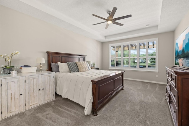 1113 Fieldstone Cir, Oviedo, FL 32765 - carpeted bedroom with a tray ceiling and ceiling fan